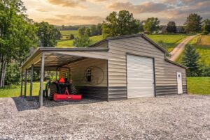 Metal shed with attached carport sheltering a tractor on a rural property
